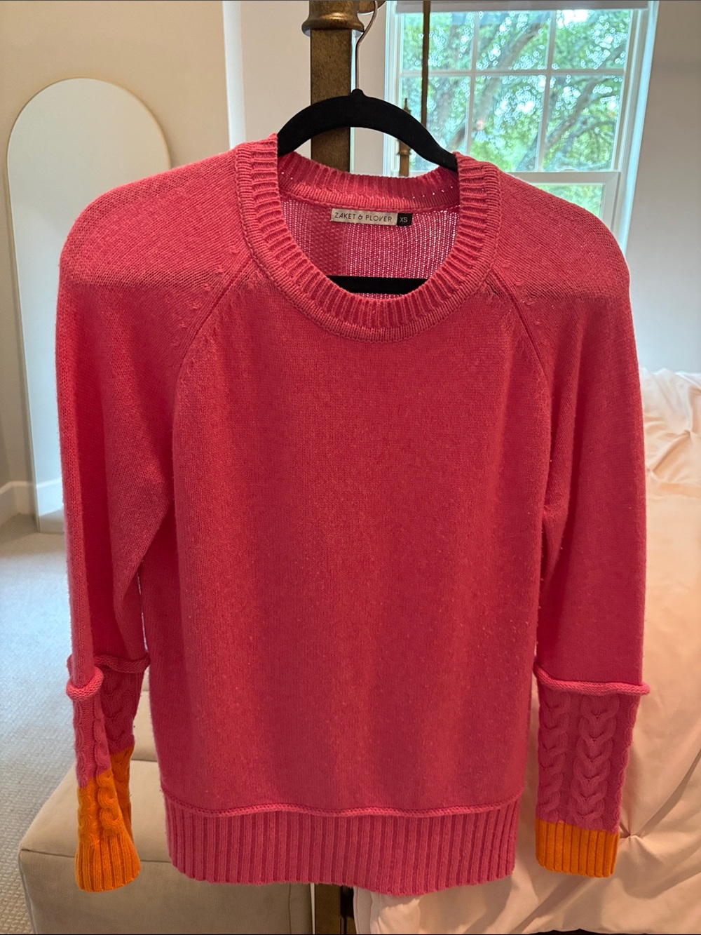 Zaket & Plover Pink Sweater with Orange Cable-Cuff Sleeves